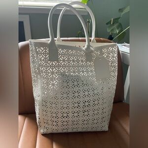 Tory Burch laser cut handle bag
